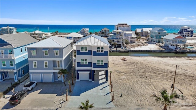 bird's eye view featuring a water view and a residential view