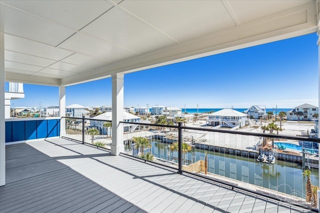 wooden deck featuring a water view