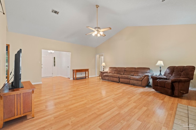 living room featuring light wood-type flooring, ceiling fan, and lofted ceiling