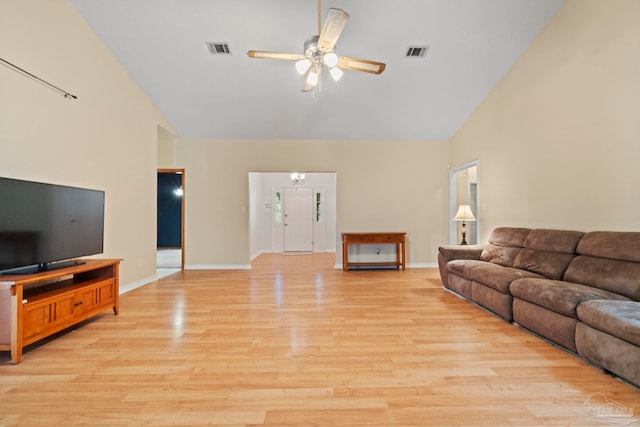 living room with ceiling fan, high vaulted ceiling, and light hardwood / wood-style floors