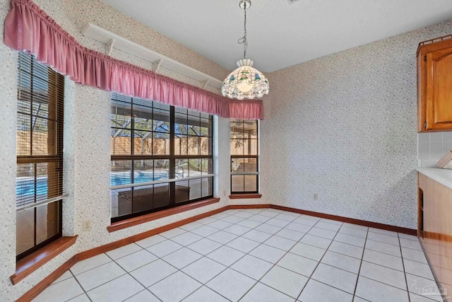 unfurnished dining area with light tile patterned floors