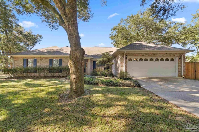 ranch-style home with a garage and a front lawn