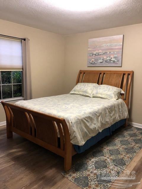 bedroom featuring hardwood / wood-style flooring