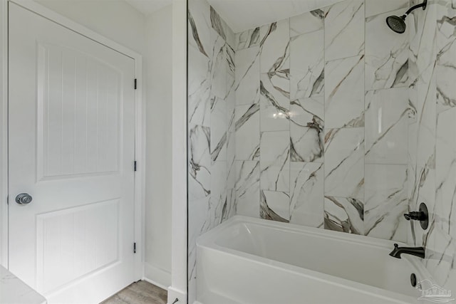 214 Thayer Ave, Pensacola, FL 32507 - full bath featuring wood finished floors and shower / bathtub combination