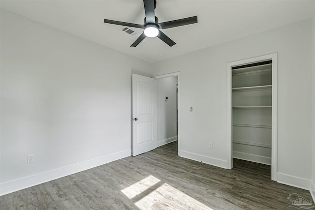 214 Thayer Ave, Pensacola, FL 32507 - unfurnished bedroom with a closet, visible vents, wood finished floors, a walk in closet, and baseboards