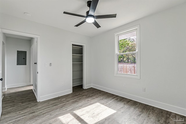 214 Thayer Ave, Pensacola, FL 32507 - unfurnished bedroom featuring ceiling fan, a closet, electric panel, wood finished floors, and baseboards