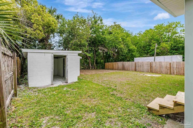 214 Thayer Ave, Pensacola, FL 32507 - view of yard featuring a storage shed, a fenced backyard, and an outdoor structure