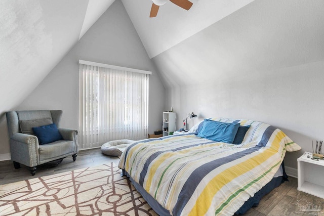 bedroom with wood-type flooring, lofted ceiling, and ceiling fan