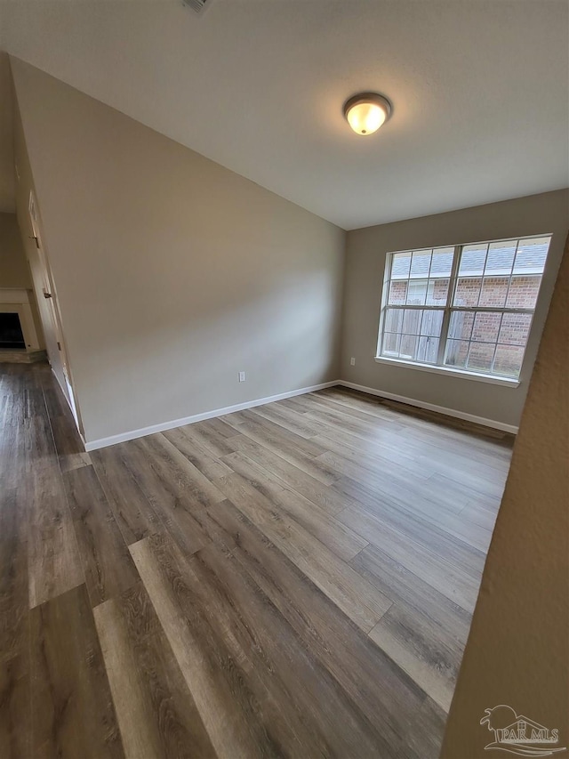 unfurnished room featuring hardwood / wood-style floors