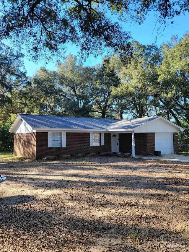 single story home with a garage