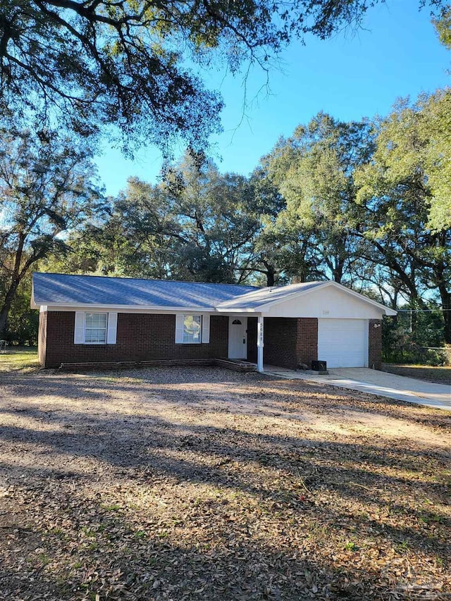 single story home with a garage