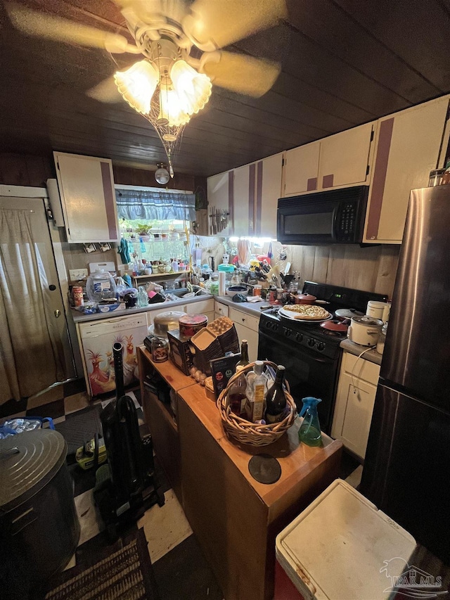 kitchen with white cabinets, ceiling fan, light countertops, a kitchen island, and black appliances