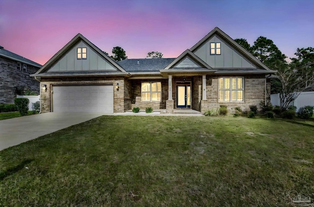 craftsman-style house with a lawn and a garage