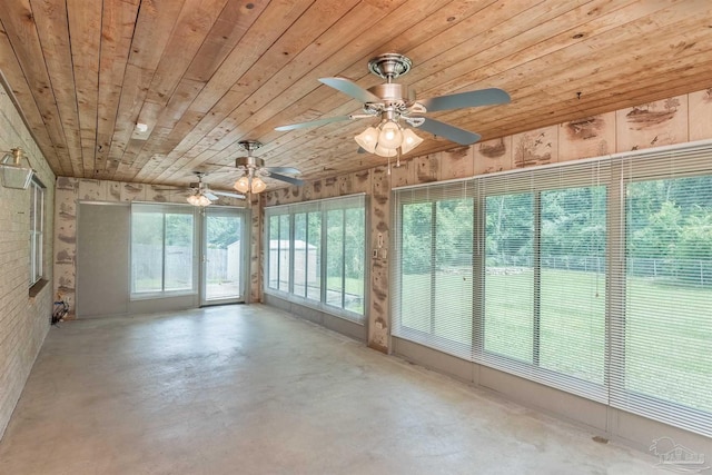 unfurnished sunroom with wooden ceiling