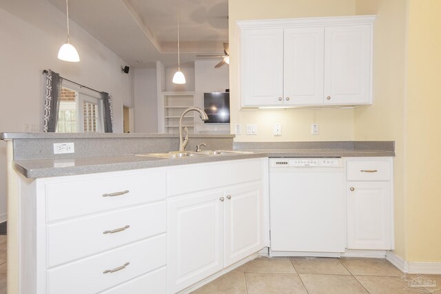 kitchen featuring track lighting, white cabinets, appliances with stainless steel finishes, and a center island