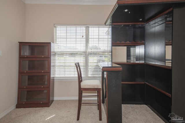 carpeted office with crown molding and a notable chandelier