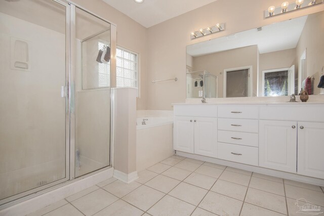 carpeted bedroom with a tray ceiling and ceiling fan