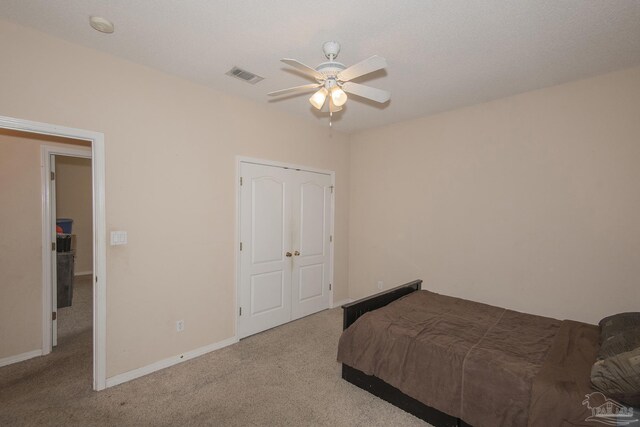 carpeted bedroom with ceiling fan