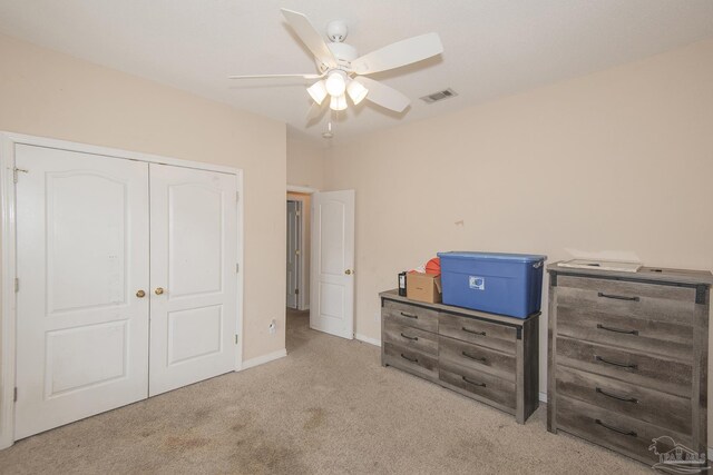 unfurnished bedroom featuring a closet, ceiling fan, and carpet floors