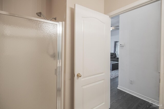 bathroom featuring tile patterned flooring, vanity, toilet, and walk in shower