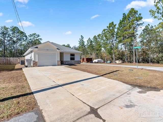 view of front of home featuring a garage and a front yard