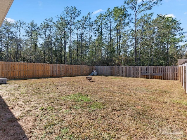 view of yard with an outdoor fire pit