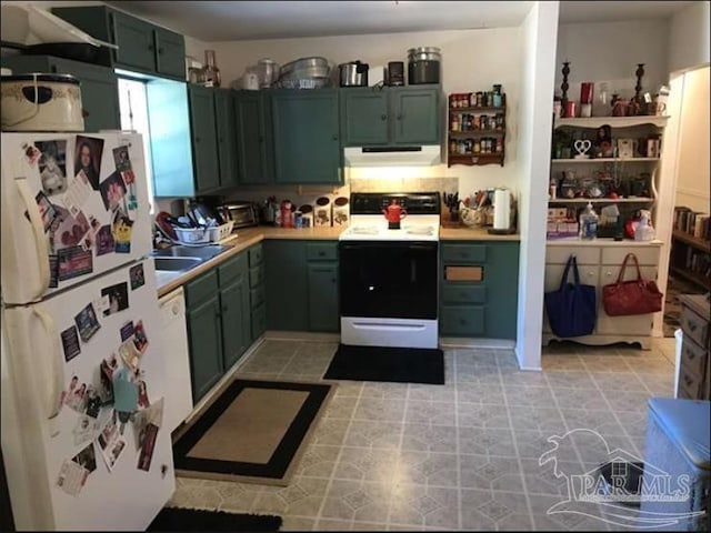 kitchen with green cabinetry and white appliances