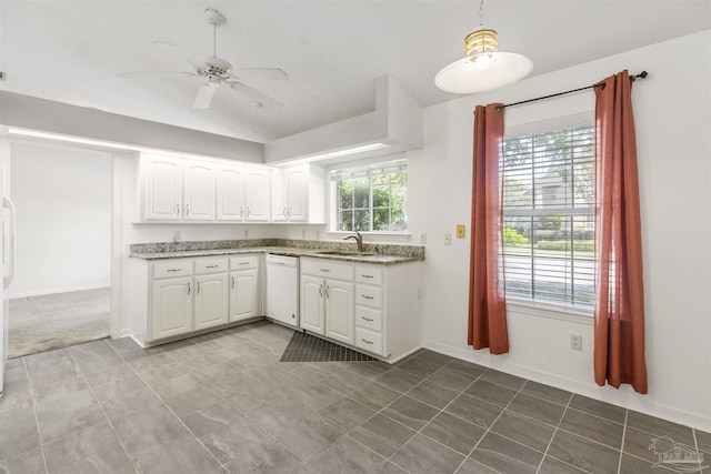 kitchen featuring dishwasher, white cabinetry, sink, and a healthy amount of sunlight