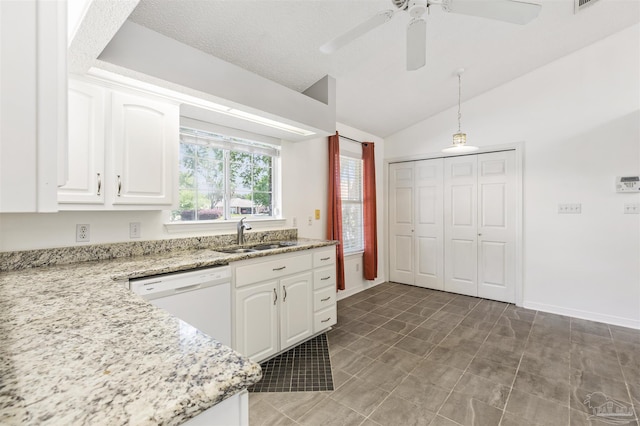 kitchen with pendant lighting, sink, dishwasher, light stone counters, and white cabinets