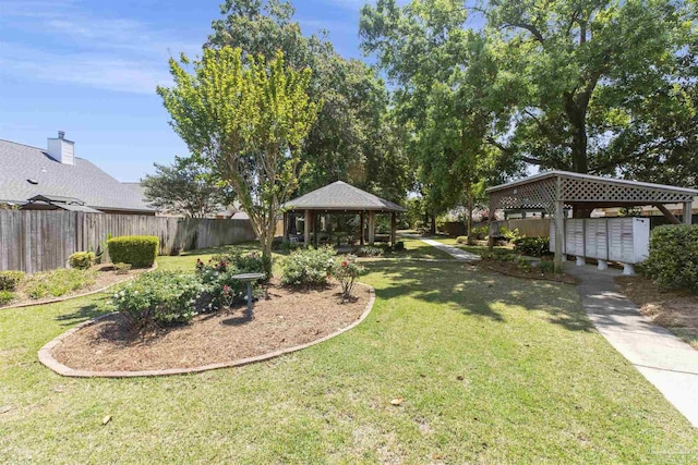 view of yard featuring a gazebo and mail boxes