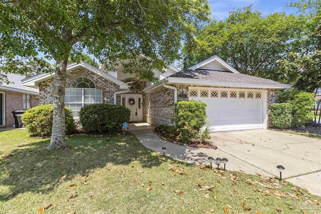 ranch-style home featuring a garage and a front lawn