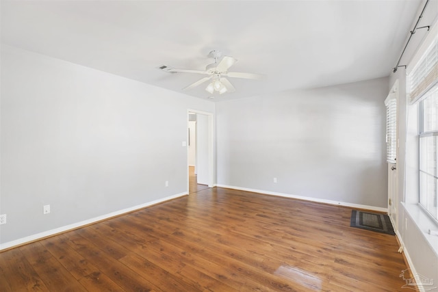 spare room featuring hardwood / wood-style flooring and ceiling fan