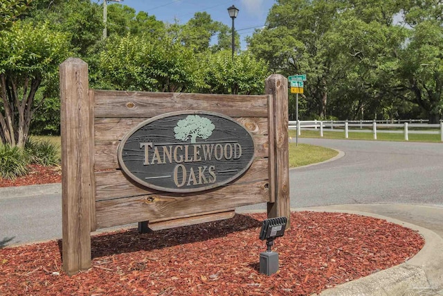 community sign with fence
