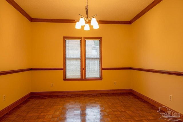 empty room featuring crown molding, parquet flooring, and a chandelier