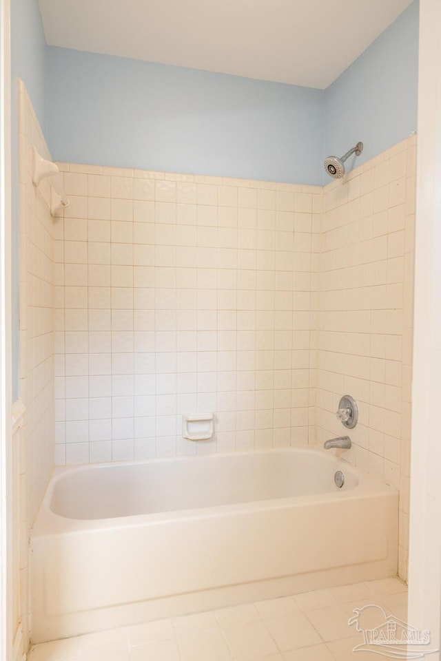 bathroom with tile patterned flooring and tiled shower / bath combo