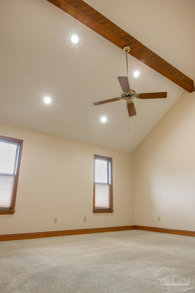 carpeted spare room with high vaulted ceiling and ceiling fan