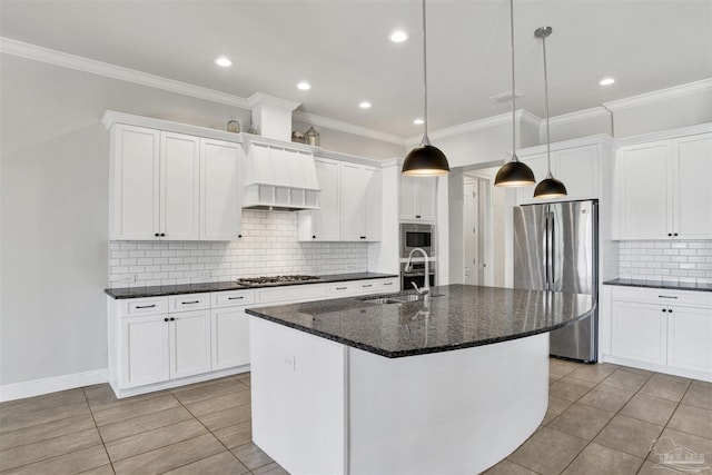 5936 Huntington Creek Blvd, Pensacola, FL 32526 - kitchen featuring stainless steel appliances, backsplash, a kitchen island with sink, light tile patterned floors, and white cabinetry