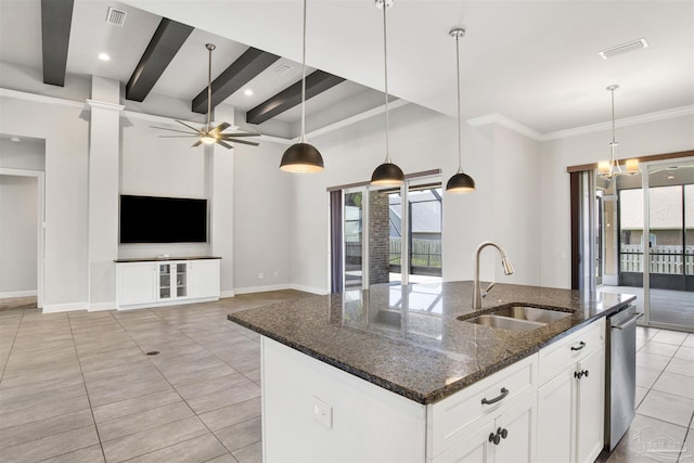5936 Huntington Creek Blvd, Pensacola, FL 32526 - kitchen with healthy amount of natural light, a kitchen island with sink, decorative light fixtures, white cabinets, and beamed ceiling