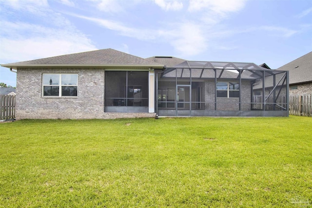 5936 Huntington Creek Blvd, Pensacola, FL 32526 - rear view of house featuring brick siding and glass enclosure