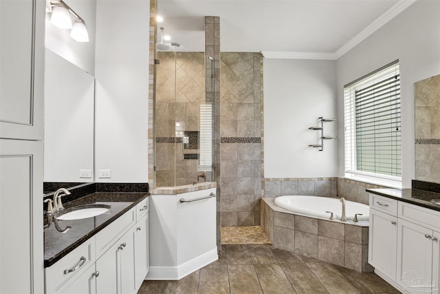 5936 Huntington Creek Blvd, Pensacola, FL 32526 - bathroom featuring vanity, a walk in shower, a garden tub, and crown molding