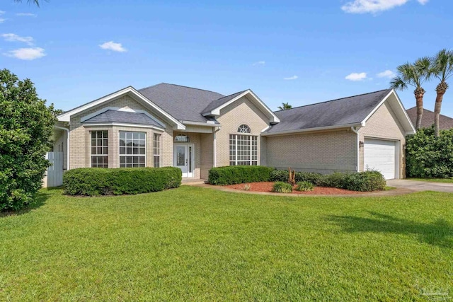 2006 Costa Verde Ct, Navarre, FL 32566 - ranch-style house with brick siding, an attached garage, a front yard, and concrete driveway