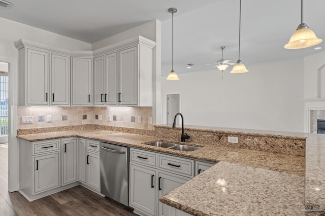 2006 Costa Verde Ct, Navarre, FL 32566 - kitchen with dishwasher, a sink, a ceiling fan, decorative backsplash, and light stone countertops
