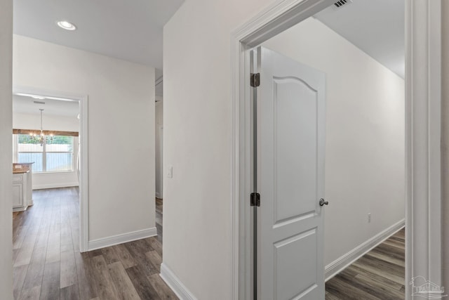 2006 Costa Verde Ct, Navarre, FL 32566 - corridor featuring dark wood-type flooring, a chandelier, baseboards, and recessed lighting
