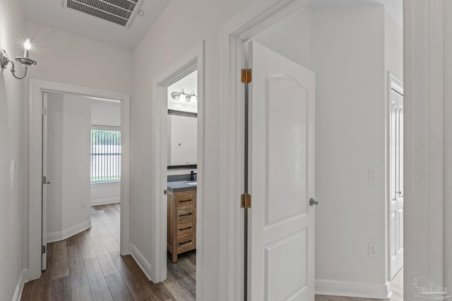 2006 Costa Verde Ct, Navarre, FL 32566 - hallway featuring dark wood finished floors and baseboards