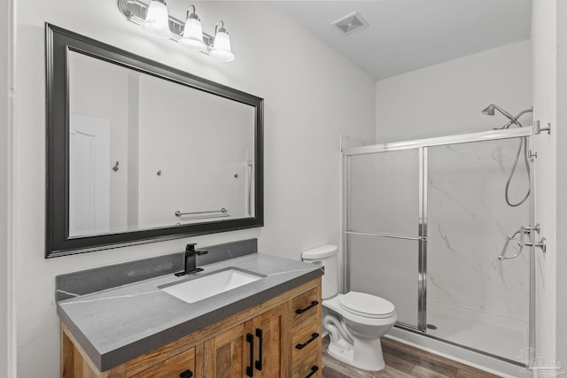 2006 Costa Verde Ct, Navarre, FL 32566 - full bathroom with vanity, a marble finish shower, toilet, and wood finished floors