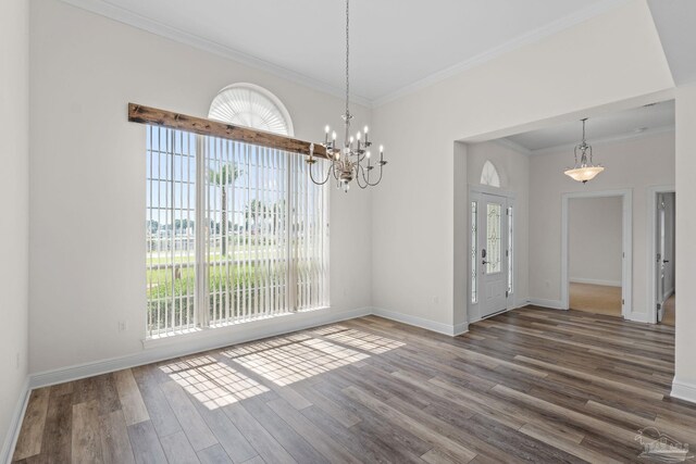 2006 Costa Verde Ct, Navarre, FL 32566 - spare room with healthy amount of natural light, ornamental molding, wood finished floors, and baseboards