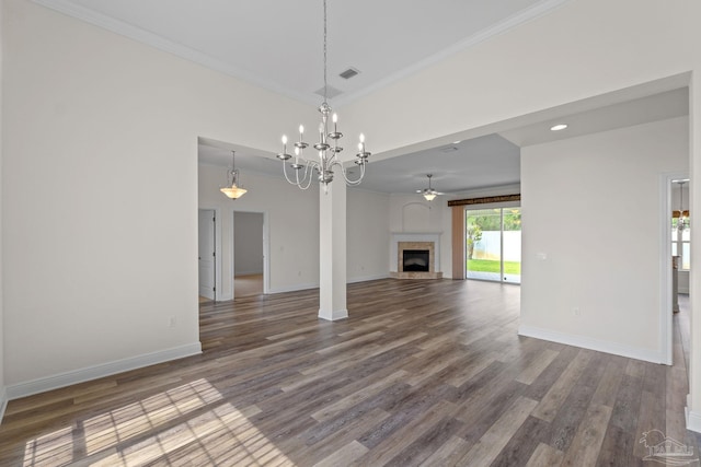 2006 Costa Verde Ct, Navarre, FL 32566 - unfurnished living room featuring a chandelier, wood finished floors, ornamental molding, baseboards, and a tile fireplace