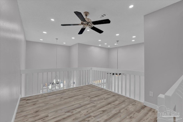 601 E Burgess Rd Unit J2, Pensacola, FL 32504 - unfurnished room with a ceiling fan, recessed lighting, wood finished floors, and baseboards