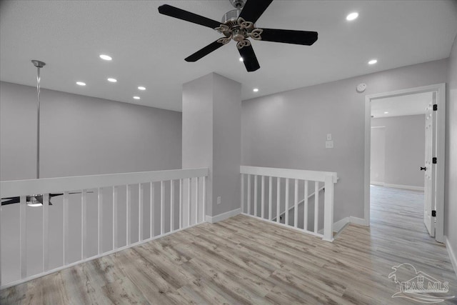 601 E Burgess Rd Unit J2, Pensacola, FL 32504 - spare room featuring wood finished floors, recessed lighting, ceiling fan, and baseboards