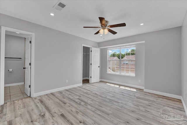 601 E Burgess Rd Unit J2, Pensacola, FL 32504 - empty room with ceiling fan, wood finished floors, baseboards, recessed lighting, and a textured ceiling